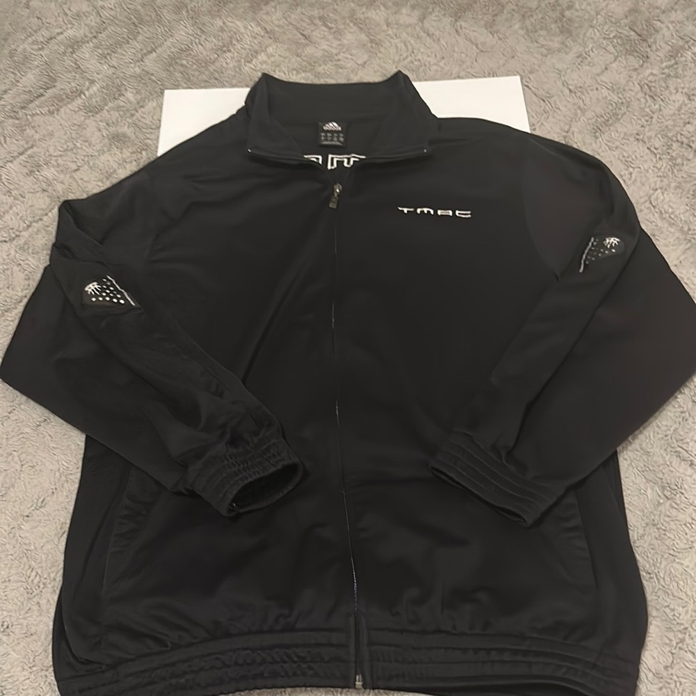 A vintage Tracy Mcgrady Houston rockets 2004 Adidas warm up jacket.